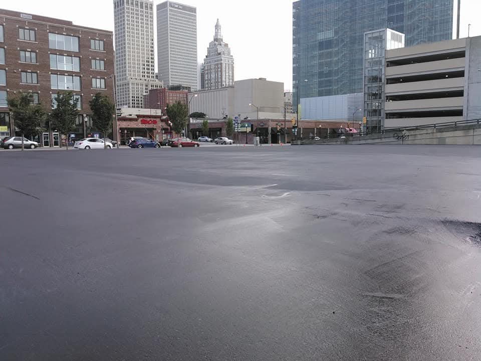 Fresh sealcoat on downtown parking lot